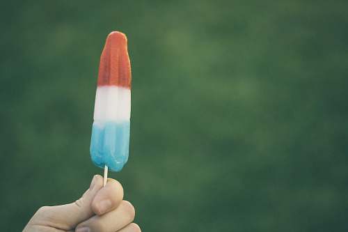 ice lolly person holding ice pop ice pop